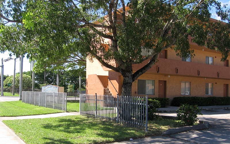 Campbell Arms Apartments fence and building exterior