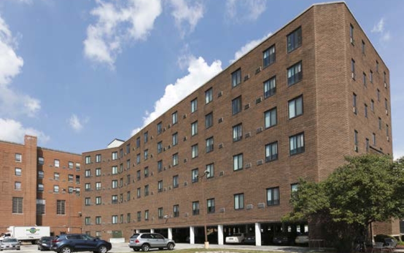 Brick building exterior and parking lot