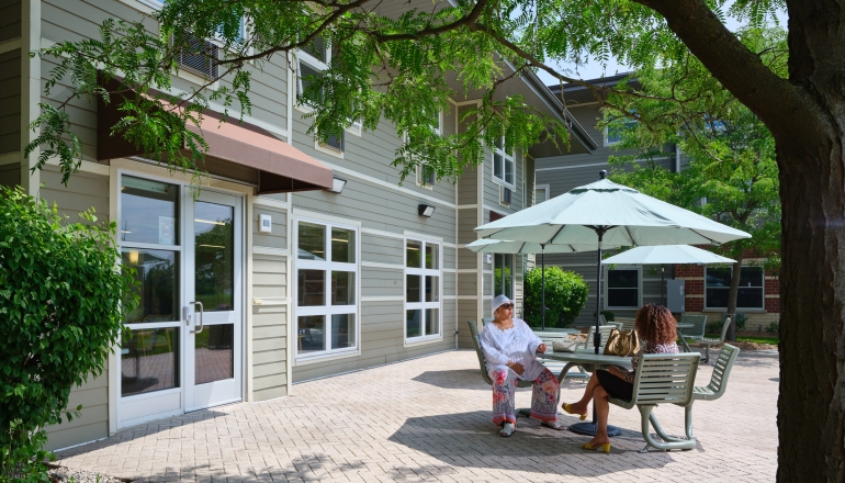 Building exterior with tables and chairs