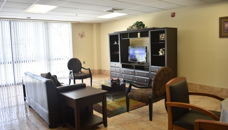New Horizons Apartments Common room TV area
