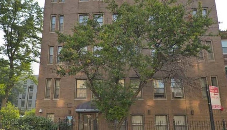 Corcoran Place Apartments brick exterior & trees
